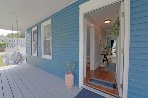 a blue house with a front door and a porch at Beautiful Modern Beach House! in Old Orchard Beach