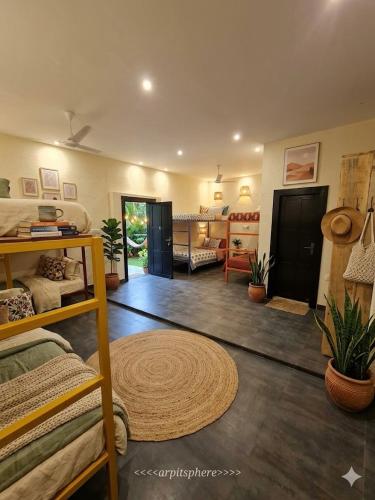 a room with a bed and a living room at Mount Magica - Refined By Nature in Rānchī