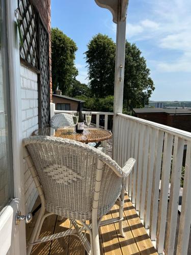 a patio with a table and chairs on a porch at The Vicar's View at the Old Vicarage in Lincoln