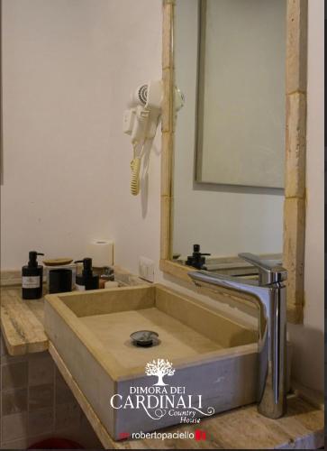 a bathroom with a sink and a mirror at Dimora dei Cardinali in Agropoli