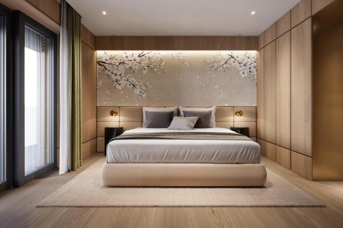 a bedroom with a bed and a painting on the wall at Campiglio PLAZA in Madonna di Campiglio