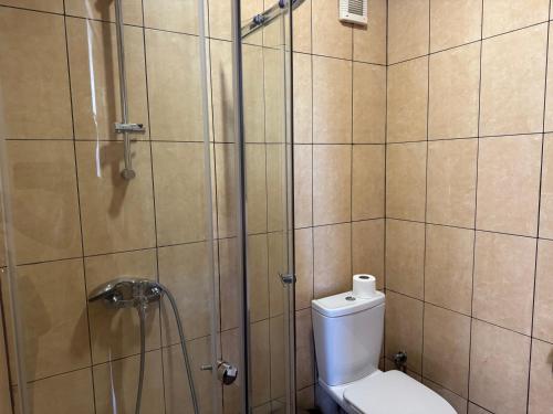a bathroom with a shower and a toilet in it at VP Bellevue in Ravda