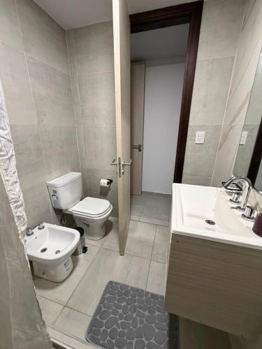 a bathroom with a toilet and a sink at Amalfi Apart in Villa María