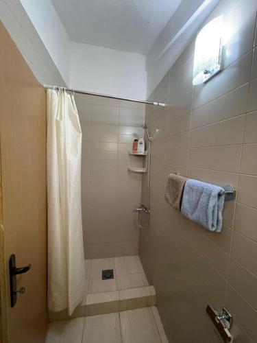 a bathroom with a shower with a shower curtain at Villa Panoramic Sea View in Seoca