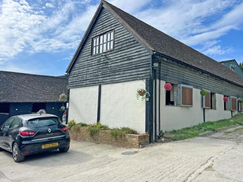 a car parked in front of a building at The Flat The Farm in Godstone