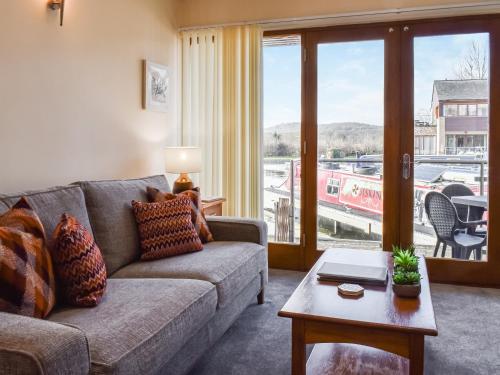 a living room with a couch and a table at Swan House in Carnforth