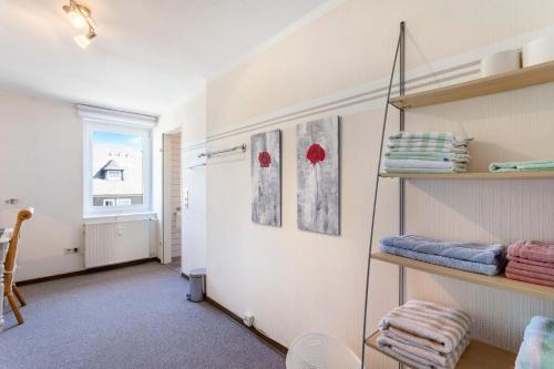 a room with some shelves and a window at Ferienwohnung Coerdt Sauerland in Olsberg