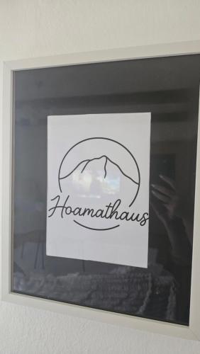 a sign on a window with the words homegrownlins at Ferienhaus - Hoamathaus in Aigen im Ennstal