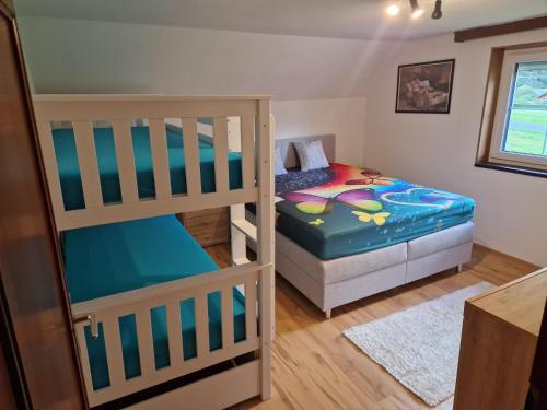 a bedroom with two bunk beds at Ferienhaus mit Bergblick am Wald in Stall