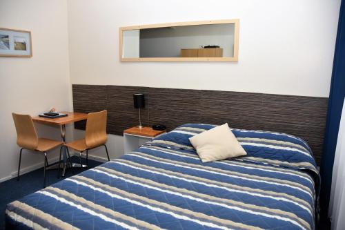 Postel nebo postele na pokoji v ubytování Chinchilla Motel