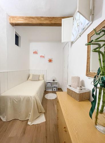 a bedroom with a bed and a table with a plant at Pietro Guest House in Cortona