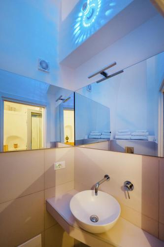a bathroom with a sink and a mirror at Stella di Mare in Procida