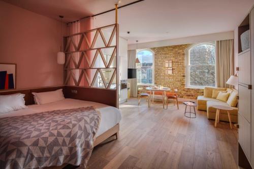 a bedroom with a bed and a living room at Zanzibar Locke in Dublin