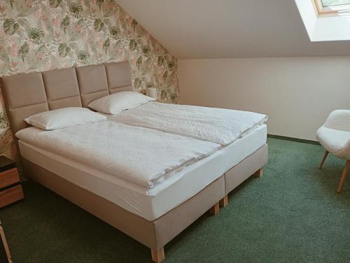 a bedroom with a large bed with a headboard at Apartament Miłków Karkonosze in Miłków