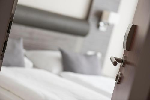 Katil atau katil-katil dalam bilik di Hotel Westfalia