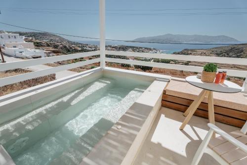 a swimming pool on the balcony of a house at Asterry Suites in Kimolos