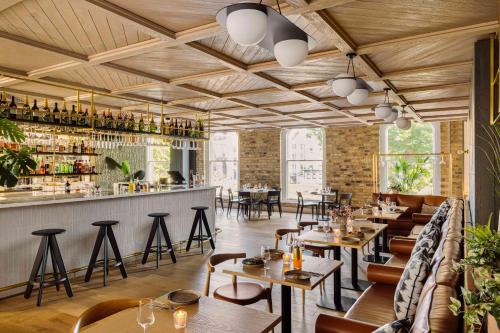 a restaurant with tables and chairs and a bar at Zanzibar Locke in Dublin