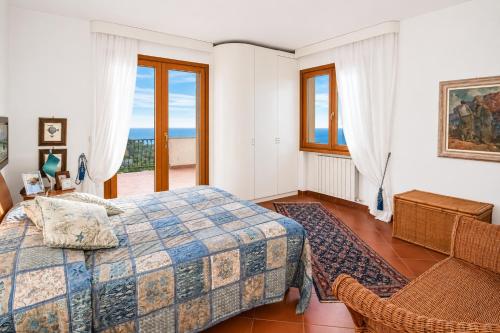 a bedroom with a bed and a window at Casa Aldrovandi in Capoliveri