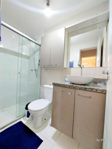 a bathroom with a toilet and a sink and a shower at Graciosa Reserva Ipanema in Porto Alegre