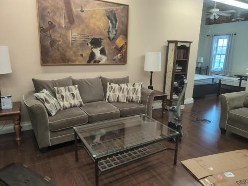 a living room with a couch and a coffee table at 2 bed, 1 bath riverfront loft in Salisbury
