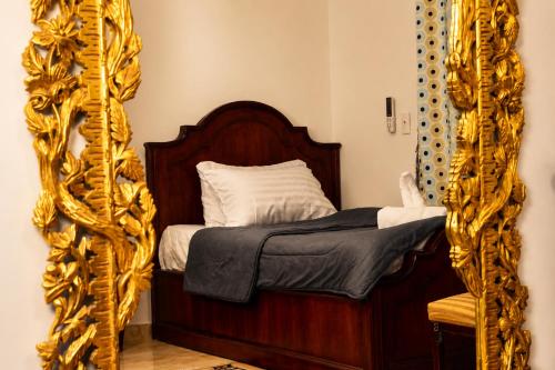 a bedroom with a bed and a mirror at Nile Pyramidal view place in Cairo