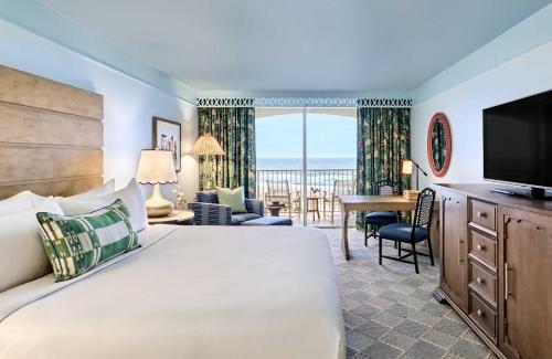 a hotel room with a bed and a television at Omni Amelia Island Resort & Spa in Amelia Island