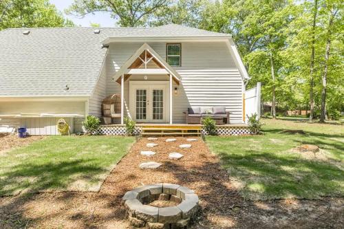 a house with a fire pit in the yard at Charming Farmhouse Getaway 7 Beds in Centerville