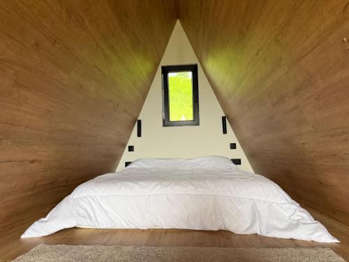 a bedroom with a large bed with a window at View Retreat in Visoko