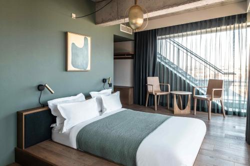 เตียงในห้องที่ WunderLocke Munich
