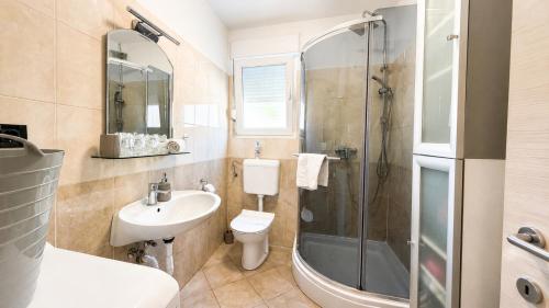 a bathroom with a sink toilet and a shower at K&D in Rijeka