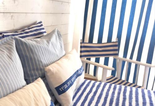 a bed and a rocking chair in a room at Nautic in Quarteira