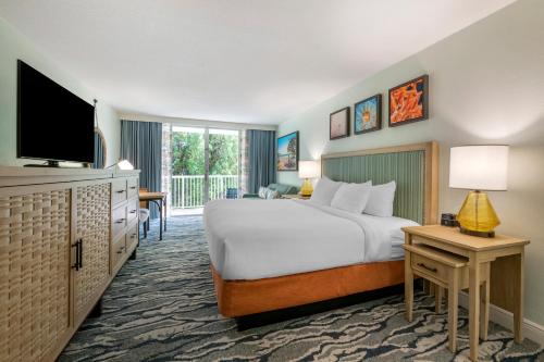 a hotel room with a bed and a television at Bluegreen Vacations Hammocks at Marathon, Ascend Collection Resort in Marathon