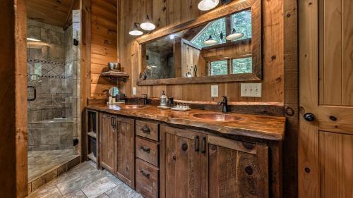 a bathroom with two sinks and a shower at Living Waters in Blue Ridge