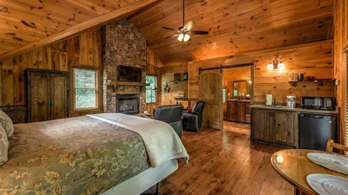 a bedroom with a bed in a room with wooden walls at Living Waters in Blue Ridge