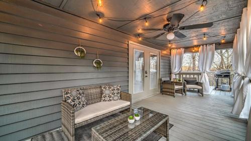 a porch with a couch and a ceiling fan at Love Affair in Epworth