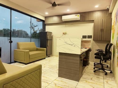 an office with a desk and a chair in a room at Hotel Fortune, Althan in Surat