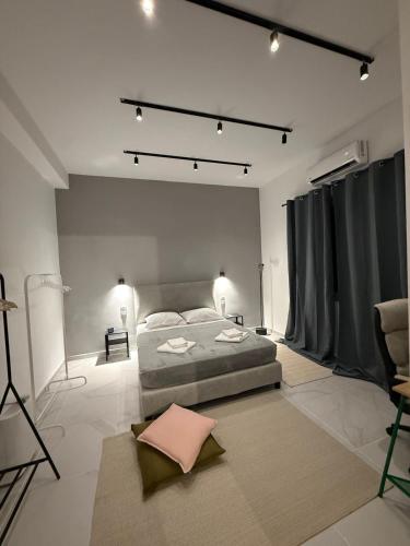 a large bedroom with a bed and a rug at Slow Living Home in Kilada