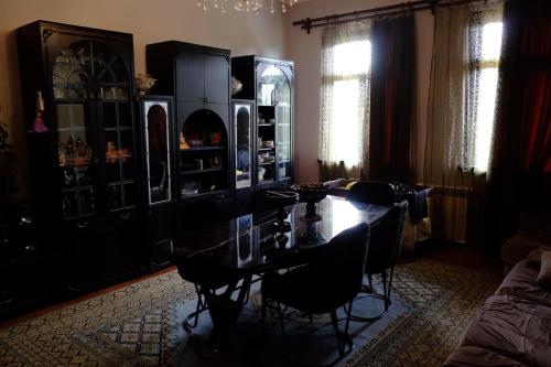 a dining room with a table and chairs at Tsikhisdziri House 3 in Ts'ikhisdziri