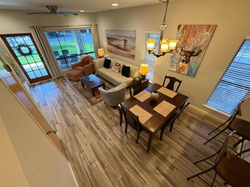 an aerial view of a living room with a table and chairs at CW C101 Condo de Comal in New Braunfels