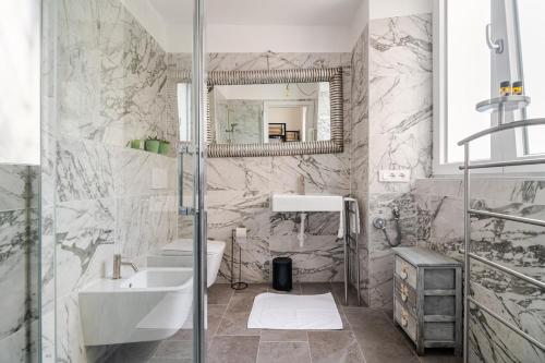 a bathroom with a sink and a mirror at Ca del Lac, few steps from Lake Maggiore in Porto Valtravaglia