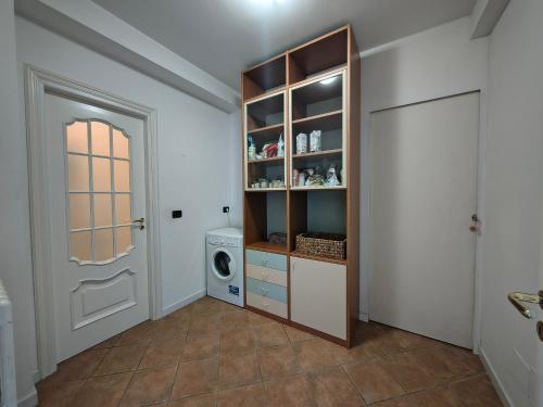 a laundry room with a washer and dryer at Sunset Garden Sanremo in Sanremo