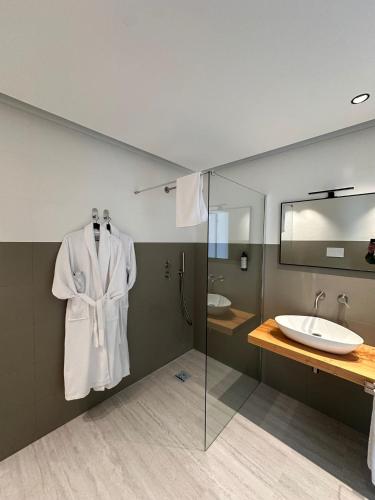 a bathroom with a sink and a mirror at Zahir Rooms & Wellness srls in Trapani