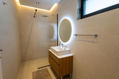 a bathroom with a sink and a mirror at Villa Sunset Mostar in Mostar