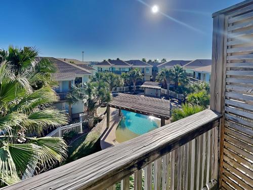 a balcony with a view of a swimming pool at Baja Breeze in Port Aransas
