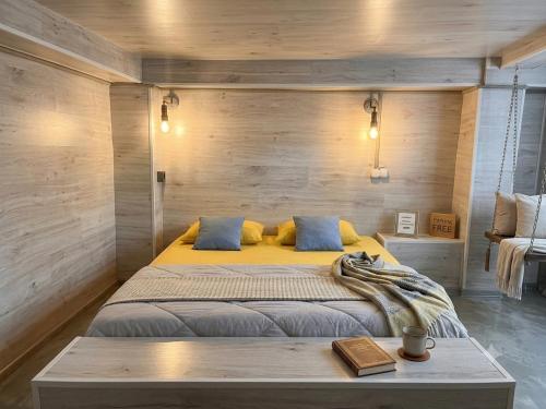a bedroom with a large bed with a wooden wall at Bulevard Stefan 64#11 Chill Hotel in Chişinău