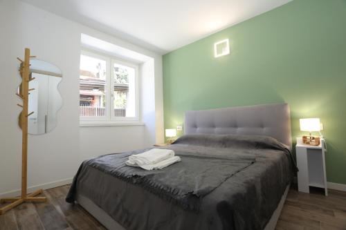 a bedroom with a bed and a window at Casa Bea 3 in Castione della Presolana