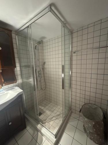 a shower with a glass door in a bathroom at Moraitis Studios in Skiros