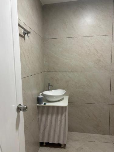 a bathroom with a sink and a shower at Hotel Velvet Vista in Rishīkesh