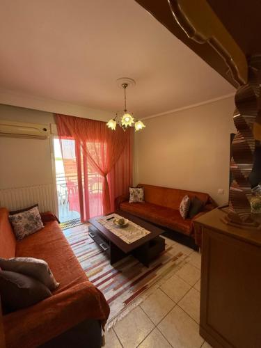 a living room with two couches and a table at Olympus View - Valentina in Litochoro