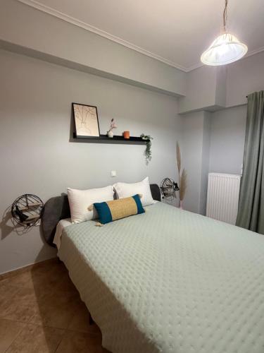 a bedroom with a large bed in a room at The Stay in Igoumenitsa
